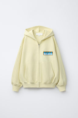 SUDADERA CREMALLERA ESTAMPADO / Amarillo claro