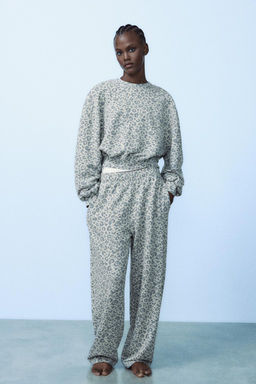 WASHED-EFFECT ANIMAL PRINT TROUSERS