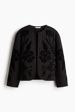 Chaqueta acolchada con aplicaciones