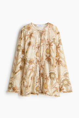 Blusa con estampado floral y lazadas