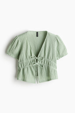 Top arrugado con lazada doble