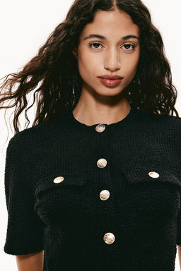 Cardigan de manga corta en boucle