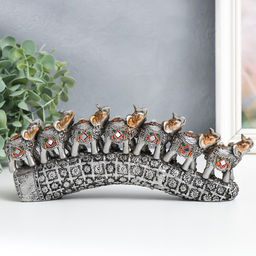 Фигурка полистоун «Семь слонов на бивне с цветами», серебро, 21×4×9.8 см