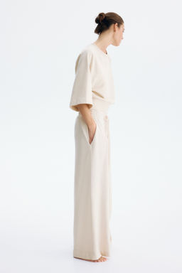 Pantal?n con cord?n de ajuste y pliegue decorativo - H&m фото 6
