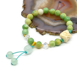 Браслет Голова Льва шарик 8мм цвет зелено-желтый, 17см