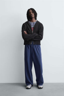 TECHNICAL TROUSERS WITH TAPING