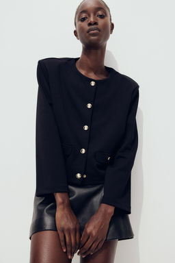 Cardigan con hombreras