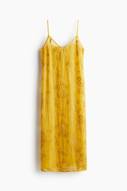 Vestido de tirantes con detalles decorativos