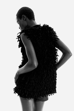 Sueter sin mangas en mezcla de lana con flecos - H&m фото 3