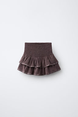 FALDA VOLANTES LENTEJUELAS / Berenjena