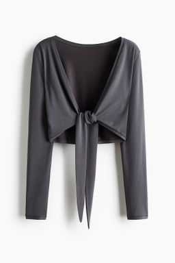 Top de yoga cropped con nudo decorativo SoftMove