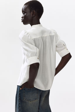 Blusa con mangas abullonadas - H&m фото 6
