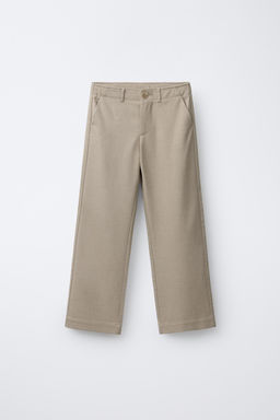 TAILORED TROUSERS WITH BUTTON