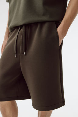 Pantal?n corto efecto neopreno Relaxed Fit - H&m фото 7