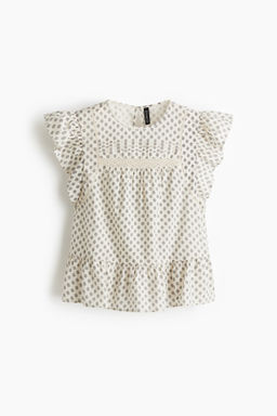 Blusa con inserciones de encaje y peplum