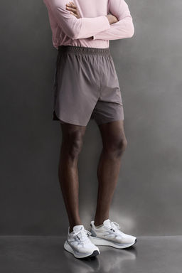 PANTALONES CORTOS RUNNING 2 EN 1 / Morado