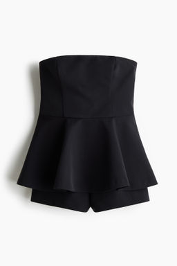 Mono corto bandeau con peplum