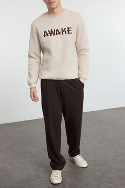 Trendyolmilla Man Tas Oversize/Genis Kesim Ici Polar/S?cak Tutan Yaz? Nak?sl? Sweatshirt TMNAW25SW00061