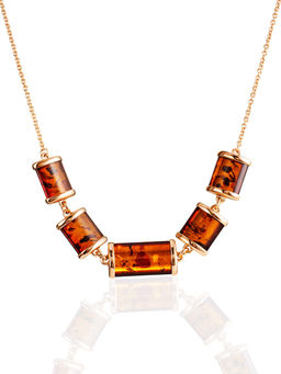 Эффектное и необычное позолоченное колье Кения с коньячным янтарём