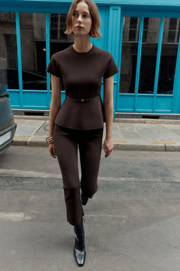 KNIT PEPLUM BELTED TOP