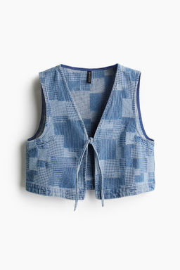 Chaleco denim efecto patchwork