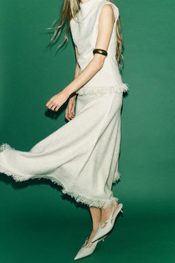 ASYMMETRIC FRINGED KNIT SKIRT