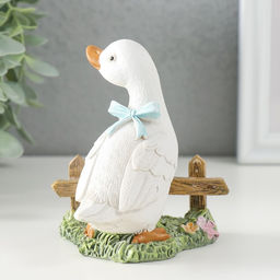 Фигурка полистоун «Гусёнок с голубым бантом у забора», 9×8×10 см