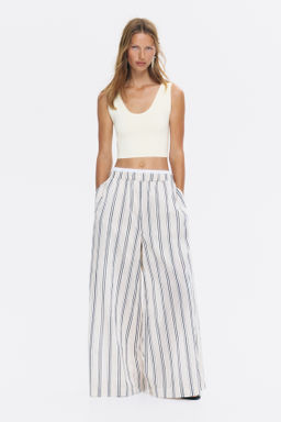 Top cropped sin mangas en punto fino - H&m фото 3