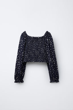 STAR PRINT TOP WITH ELASTIC DETAIL