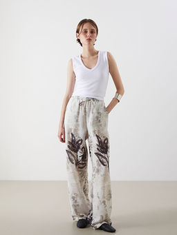 Beli Lastikli ?i?ekli Geni? Pa?a Kad?n Pantolon