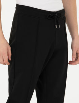 Черные новые спортивные штаны узкого кроя - Cacharel фото 5