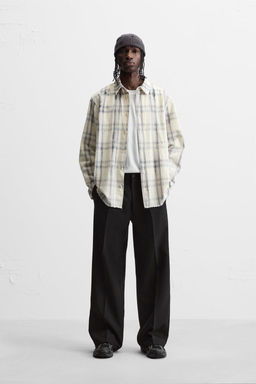 FLARED FIT PLEATED TROUSERS