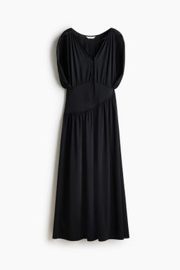 Vestido de punto con detalle efecto capa