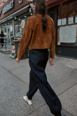 PLEATED TROUSERS WITH BUTTONED HEM