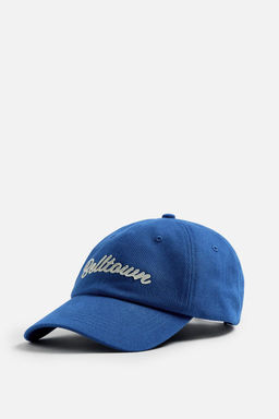 CAP WITH RAISED TEXT