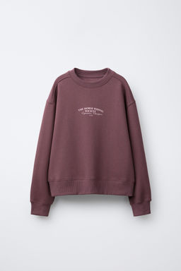 RAISED SLOGAN SWEATSHIRT