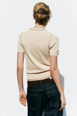 SHORT SLEEVE KNIT TOP WITH PIPING