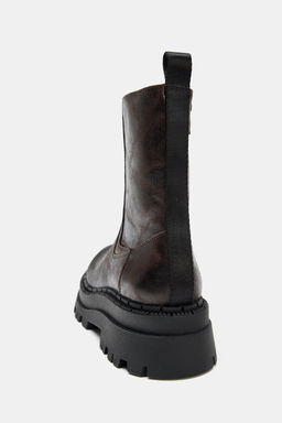 DISTRESSED-EFFECT PLATFORM ANKLE BOOTS