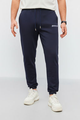 Lacivert Regular Fit Bask?l? Biyeli Lastik Paca Esofman Alt? TMNSS22EA0121