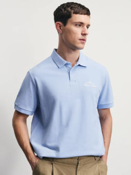 Поло с принтом на груди / Zarina