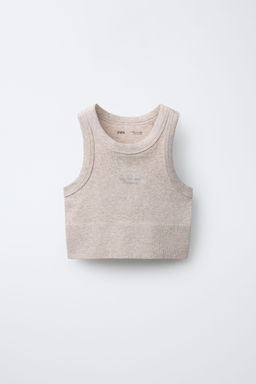 SLOGAN SEAMLESS CROP TOP