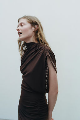 ASYMMETRIC CUT-OUT DRESS WITH EYELETS
