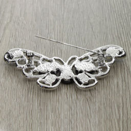 Брошь "Бабочка" со вставками из гелиотиса и ювелирного сплава