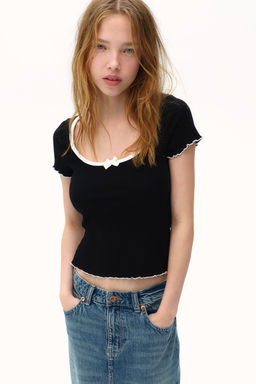 Top de canale con detalles sobrehilados