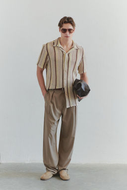 TRENDYOL MAN Limited Edition Bej Wide Leg/Genis Paca Viskoz Kar?s?ml? Kumas Pantolon TMNSS25PL00015