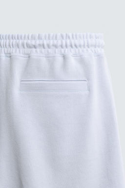 BERMUDA JOGGER RELAXED FIT INTERLOCK / Celeste