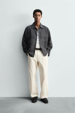 PLEATED HERRINGBONE TROUSERS