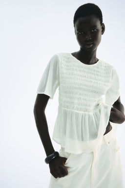 Top nido de abeja con peplum - H&m фото 6