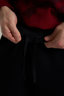 Брюки трикотажные Черный ICONIC Knit Track Pants - Anta фото 6