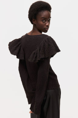 Top en punto texturizado con volantes - H&m фото 5